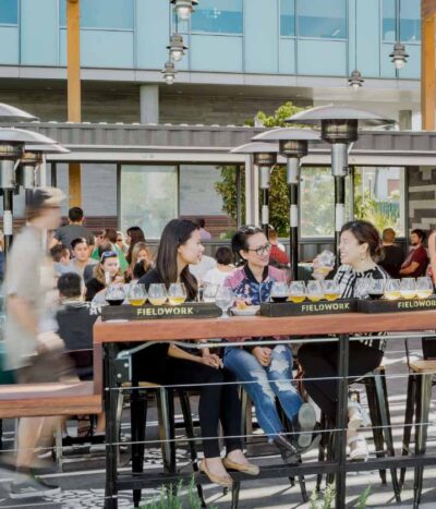 Office workers enjoy a social outdoor break at the Offices at Bay Meadows